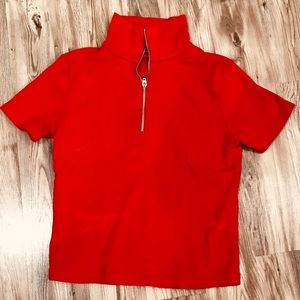 A red Brandy melville shirt.